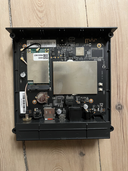 picture of a bobcat miner 300 - the chassis is opened and shows two big aluminium cases on a electronic board